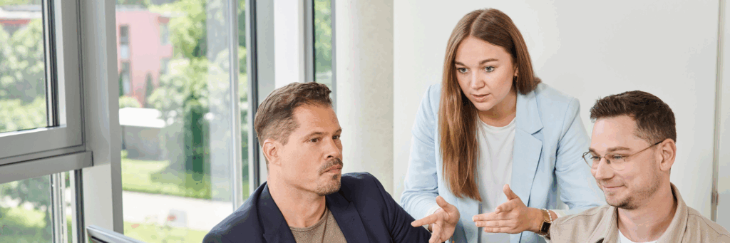 Three colleagues discussing at work