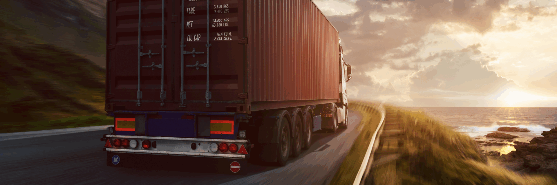 Picture shows a truck driving into sunset
