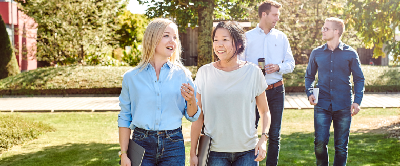 d.velop employees walking at d.velop campus