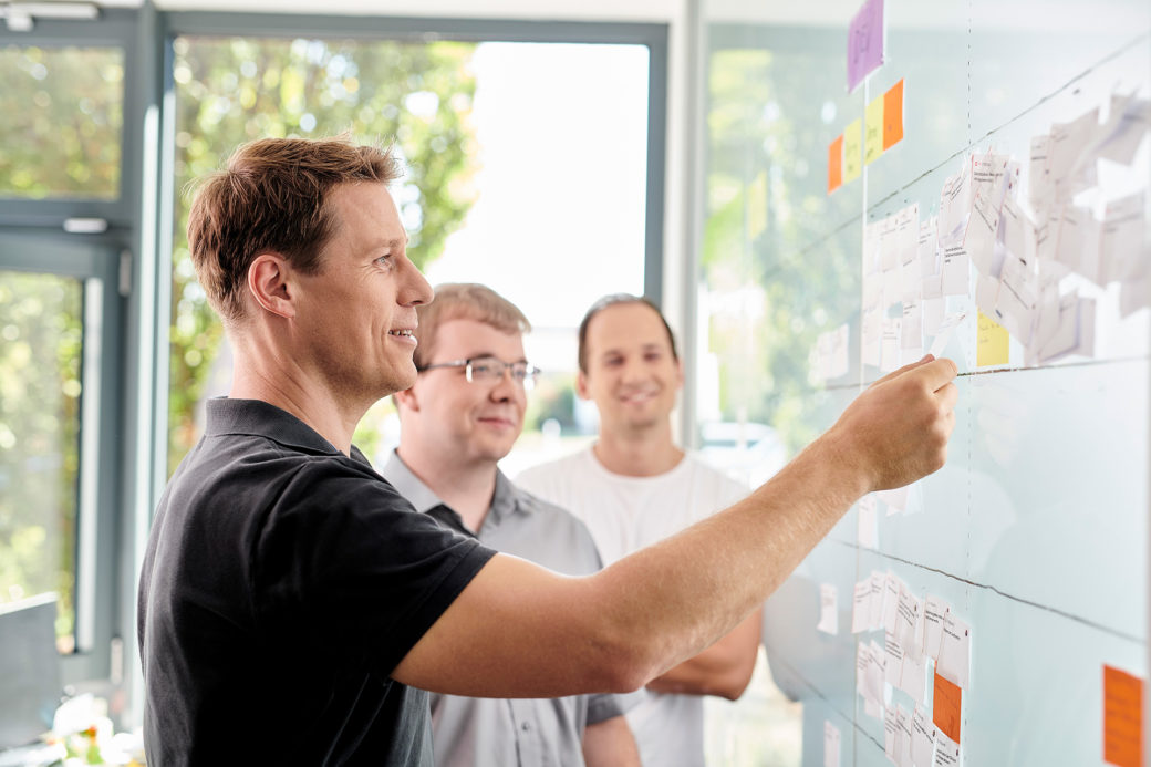 d.velop employee with whiteboard