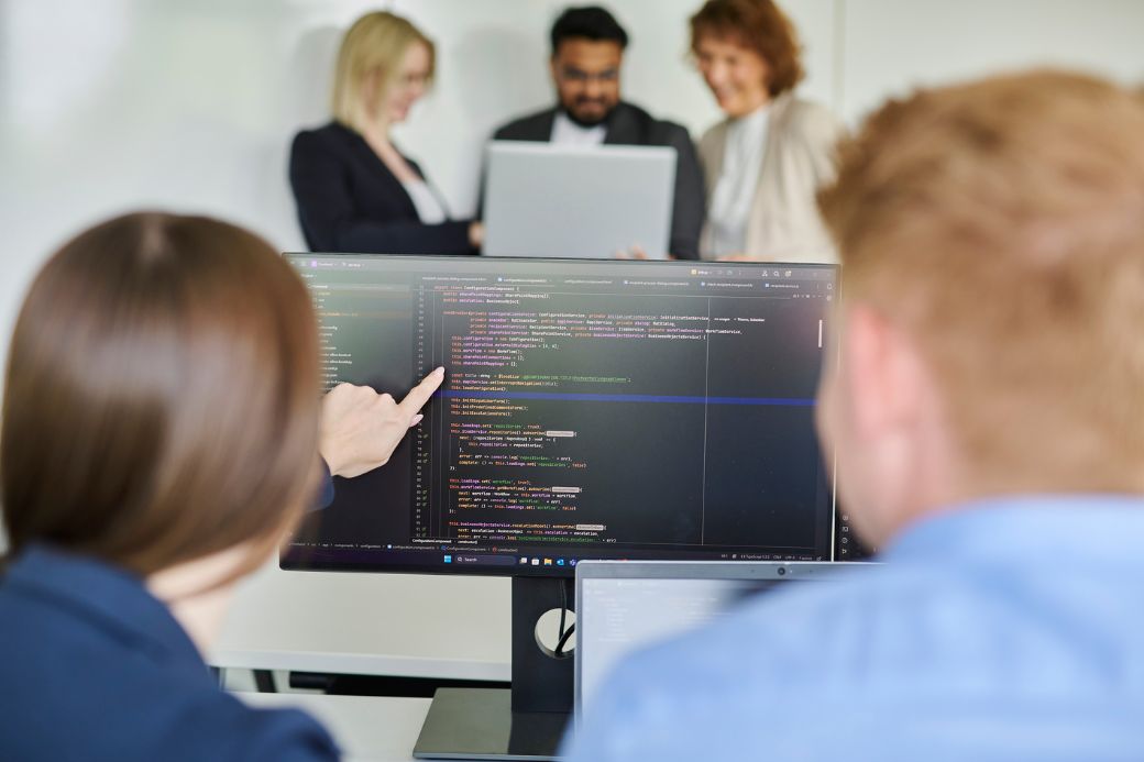 employee shows code on screen