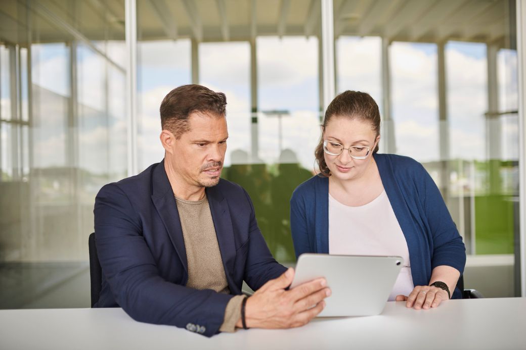 Two people with tablet pc